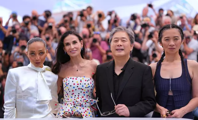 Jury president Park Chan-wook, third from left, poses with jury members Ruth Negga, from left, Demi Moore and Chloé Zhao at the jury photo call at the 79th international film festival, Cannes, southern France, Tuesday, May 12, 2026. (AP Photo/Andreea Alexandru)