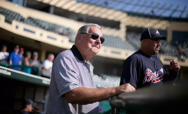 FILE - Former Atlanta Braves manager Bobby Cox, left, looks on with Braves manager Fredi Gonzalez, before a spring training baseball game against the Florida Marlins on March 23, 2011 in Kissimmee, Fla. (AP Photo/David Goldman, File)