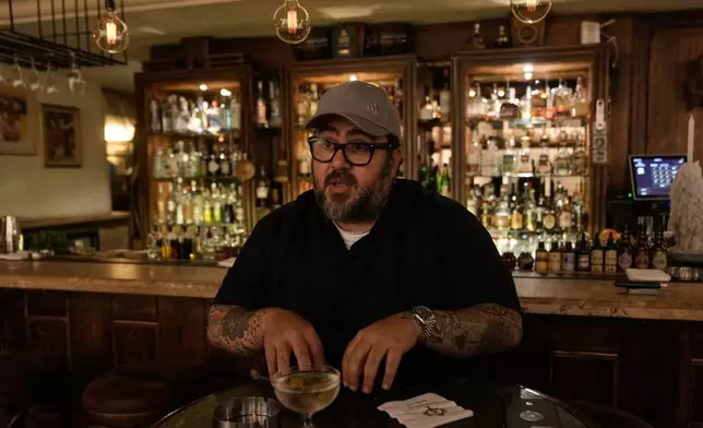 Bar and restaurant owner Riad Aboulteif speaks during an interview with The Associated Press at his bar on Hamra Street in Beirut, May 5, 2026. (AP Photo/Bilal Hussein)