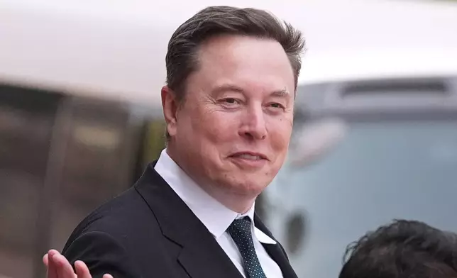 FILE - Elon Musk departs after a welcome ceremony with President Donald Trump and China's President Xi Jinping at the Great Hall of the People, Thursday, May 14, 2026, in Beijing. (AP Photo/Mark Schiefelbein, File)
