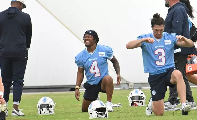 Tennessee Titans wide receiver Wan'Dale Robinson (4) warms up during NFL football practice, Thursday, May 21, 2026, in Nashville, Tenn. (AP Photo/John Amis)