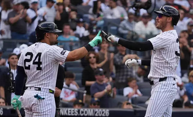 New York Yankees' Cody Bellinger, right, celebrates withJasson Domínguez after hitting a home run during the fifth inning of a baseball game against the Baltimore Orioles Saturday, May 2, 2026, in New York. (AP Photo/Frank Franklin II)