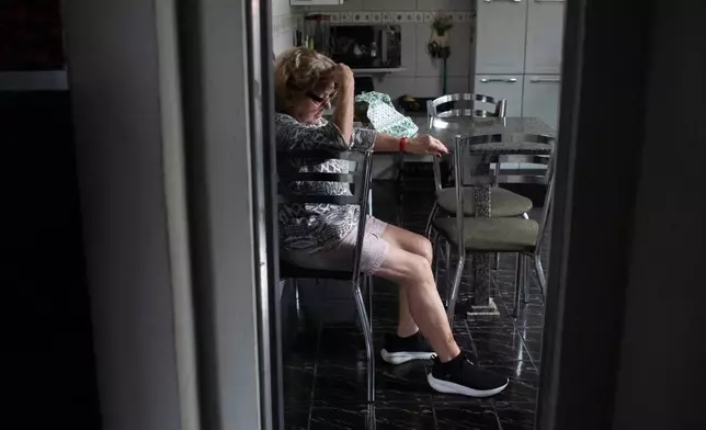 Maria Eva Marinho, who lost her son Nelson Marinho in the Air France flight 447 plane crash near the coast of Brazil on June 1, 2009, sits in her home before giving an interview in Rio de Janeiro, Thursday, May 21, 2026. (AP Photo/Bruna Prado)