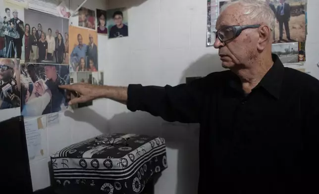 Nelson Faria Marinho, who lost his son Nelson Marinho in the Air France flight 447 plane crash near the coast of Brazil on June 1, 2009, points to a photo of him during an interview at his home in Rio de Janeiro, Thursday, May 21, 2026. (AP Photo/Bruna Prado)
