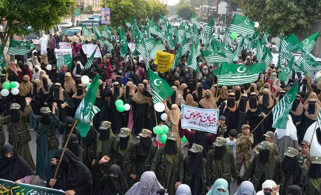 Supporters of ' Muslim women league Pakistan, hold a rally to mark the anniversary of last year's four-day conflict with neighboring India, Thursday, May 7, 2026, in Lahore, Pakistan. (AP Photo/K.M. Chaudary)
