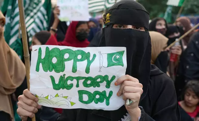 Supporters of Muslim women league Pakistan, hold a placard during rally to mark the anniversary of last year's four-day conflict with neighboring India, Thursday, May 7, 2026, in Lahore, Pakistan. (AP Photo/K.M. Chaudary)