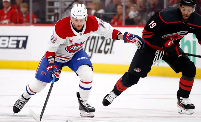 Montreal Canadiens' Zachary Bolduc (76) controls the puck near Carolina Hurricanes' K'andre Miller (19) during the first period in Game 5 of the Eastern Conference finals NHL hockey Stanley Cup playoff series in Raleigh, N.C., Friday, May 29, 2026. (AP Photo/Karl DeBlaker)