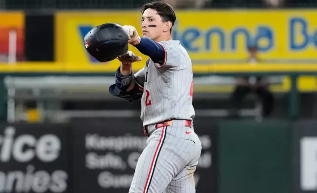 Minnesota Twins' Brooks Lee celebrates after hitting a three-run double during the 11th inning of a baseball game against the Chicago White Sox in Chicago, Tuesday, May 26, 2026. (AP Photo/Nam Y. Huh)