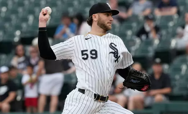 Chicago White Sox starting pitcher Sean Burke throw against the Minnesota Twins during the first inning of a baseball game in Chicago, Tuesday, May 26, 2026. (AP Photo/Nam Y. Huh)