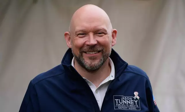 Jason Tunney, Republican candidate for the 35th Senate District, speaks at Otherside Bar and Grill Monday, April 27, 2026, in Freeland, Mich. (AP Photo/Paul Sancya)