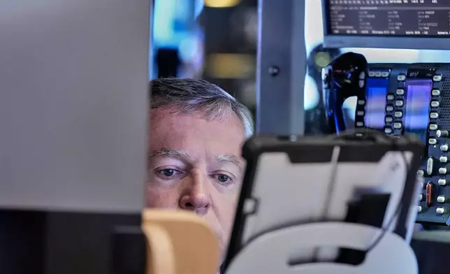 Trader James Lamb works on the floor of the New York Stock Exchange, Friday, May 22, 2026. (AP Photo/Richard Drew)
