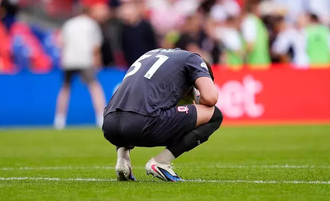 Middlesbrough goalkeeper Sol Brynn reacts after Hull City's Oliver McBurnie scores their side's first goal during the Championship play-off final between Hull City and Middlesbrough at Wembley Stadium, London, Saturday May 23, 2026. (Jordan Pettitt/PA via AP)