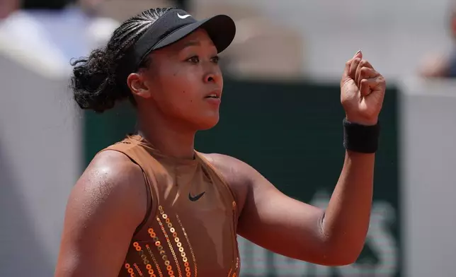 Naomi Osaka of Japan celebrates winning the third round women's singles tennis match against against Iva Jovic of the U.S. at the French Open tennis tournament in Paris, Saturday, May 30, 2026. (AP Photo/Thibault Camus)