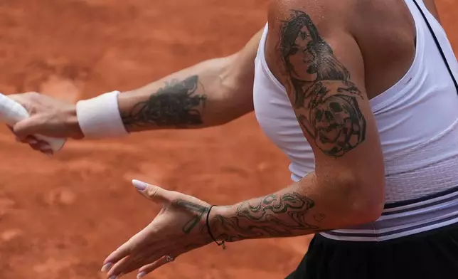 Oleksandra Oliynykova of Ukraine returns to Diana Shnaider of Russia during their third round women's singles tennis match at the French Open tennis tournament in Paris, Saturday, May 30, 2026. (AP Photo/Thibault Camus)