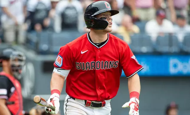 Cleveland Guardians' Travis Bazzana watches his sacrifice fly off Washington Nationals relief pitcher Orlando Ribalta during the sixth inning of a baseball game, Wednesday, May 27, 2026, in Cleveland. (AP Photo/Phil Long)