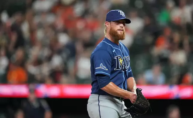 Tampa Bay Rays pitcher Craig Kimbrel returns to the dugout after retiring the side during the ninth inning of a baseball game against the Baltimore Orioles, Tuesday, May 26, 2026, in Baltimore. (AP Photo/Stephanie Scarbrough)