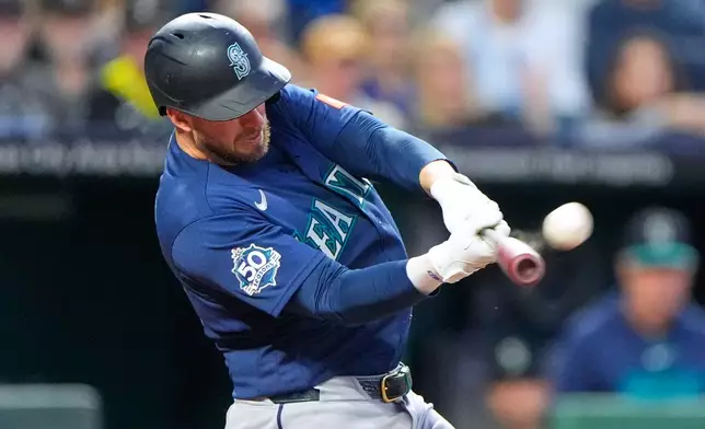 Seattle Mariners' Mitch Garver hits a two-run home run during the seventh inning of a baseball game against the Kansas City Royals, Friday, May 22, 2026, in Kansas City, Mo. (AP Photo/Charlie Riedel)