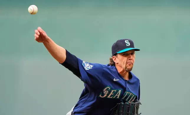 Seattle Mariners starting pitcher Logan Gilbert throws during the first inning of a baseball game against the Kansas City Royals, Friday, May 22, 2026, in Kansas City, Mo. (AP Photo/Charlie Riedel)