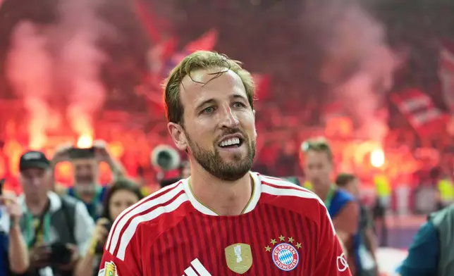 Bayern's Harry Kane celebrates after scoring during the DFB Pokal, German Cup final soccer match between VfB Stuttgart and Bayern Munich in Berlin, Germany, Saturday, May 23, 2026. (AP Photo/Ebrahim Noroozi)