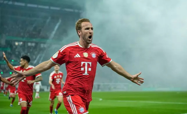 Bayern's Harry Kane celebrates after scoring his side's opening goal during the DFB Pokal, German Cup final soccer match between VfB Stuttgart and Bayern Munich in Berlin, Germany, Saturday, May 23, 2026. (AP Photo/Ebrahim Noroozi)