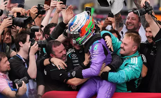 Mercedes driver Kimi Antonelli of Italy celebrates after winning the Miami Formula One Grand Prix auto race, Sunday, May 3, 2026, in Miami Gardens, Fla. (AP Photo/Rebecca Blackwell)