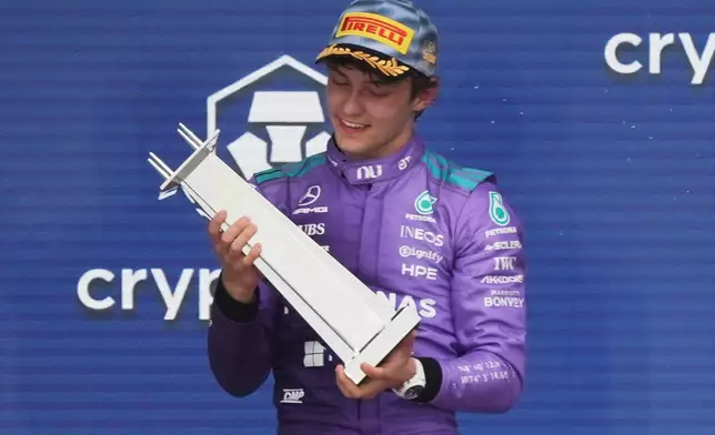 Mercedes driver Kimi Antonelli of Italy holds his trophy after winning the Miami Formula One Grand Prix auto race, Sunday, May 3, 2026, in Miami Gardens, Fla. (AP Photo/Lynne Sladky)
