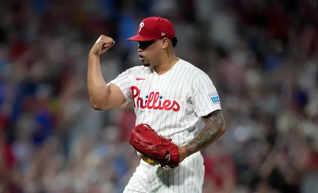 Philadelphia Phillies pitcher Jhoan Duran reacts after Cincinnati Reds' TJ Friedl grounded out to end their baseball game Monday, May 18, 2026, in Philadelphia. (AP Photo/Matt Slocum)