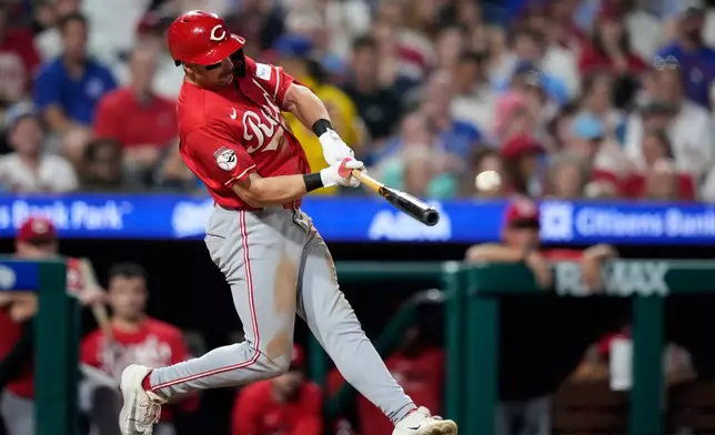 Cincinnati Reds' Spencer Steer hits a run-scoring double against Philadelphia Phillies pitcher José Alvarado during the eighth inning of a baseball game Monday, May 18, 2026, in Philadelphia. (AP Photo/Matt Slocum)