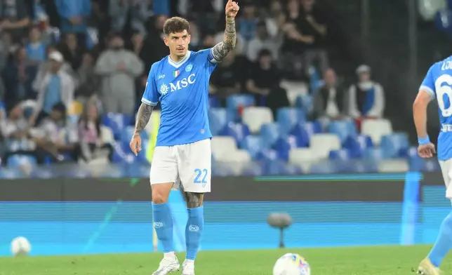 Napoli's Giovanni Di Lorenzo celebrates after scoring during the Italian Serie A soccer match between Napoli and Bologna in Naples, Italy, Monday, May 11, 2026. (Alessandro Garofalo/LaPresse via AP)