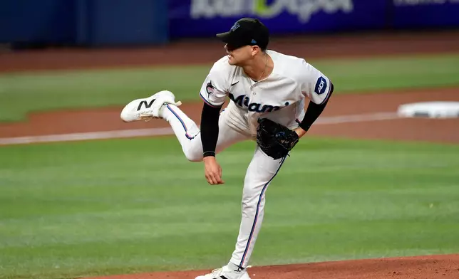 Miami Marlins pitcher Janson Junk delivers during the first inning of a baseball game against the Atlanta Braves, Wednesday, May 20, 2026, in Miami. (AP Photo/Michael Laughlin)