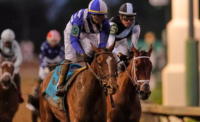 Always a Runner (9) ridden by Jose L. Ortiz wins the 152nd running of the Kentucky Oaks horse race at Churchill Downs, Friday, May 1, 2026, in Louisville, Ky. (AP Photo/George Walker IV)