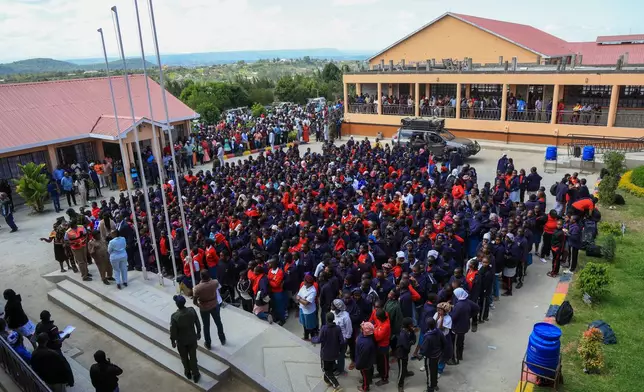 Students gather after a fire at Utumishi Girls School in Gilgil, central Kenya, Thursday, May 28, 2026. (AP Photo/Andrew Kasuku)