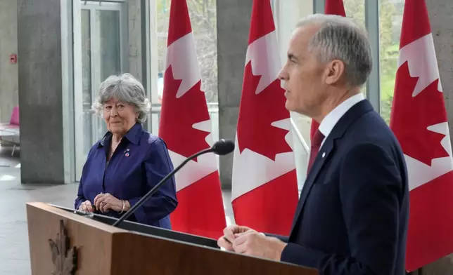 Canada Prime Minister Mark Carney and Louise Arbour take part in an announcement in Ottawa on Tuesday, May 5, 2026. (Adrian Wyld/The Canadian Press via AP)