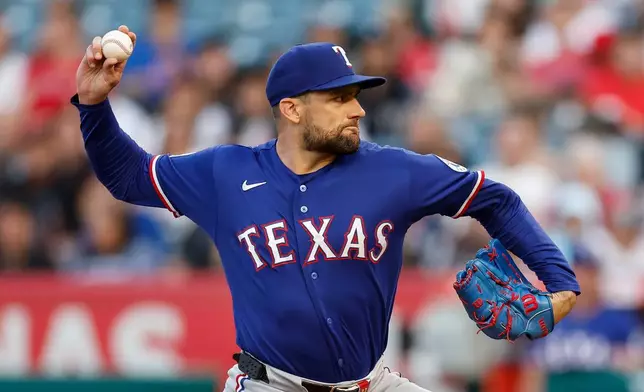 Texas Rangers starting pitcher Nathan Eovaldi delivers to the plate during the first inning of a baseball game, against the Los Angeles Angels, Saturday, May 23, 2026, in Anaheim, Calif. (AP Photo/Caroline Brehman)