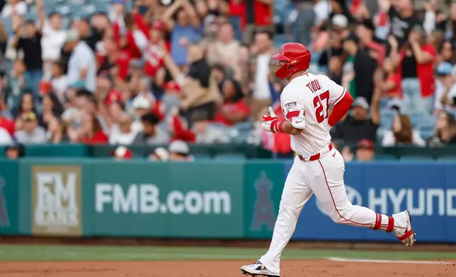 Los Angeles Angels' Mike Trout rounds the bases after hitting a two-run home run during the first inning of a baseball game against the Texas Rangers, Saturday, May 23, 2026, in Anaheim, Calif. (AP Photo/Caroline Brehman)