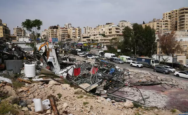 The site of an Israeli army demolition campaign that targeted several Palestinian commercial structures overnight, days after the issue of demolition and evacuation orders to owners, in the West Bank town of Al-Eizariya Tuesday, May 12, 2026. (AP Photo/Mahmoud Illean)