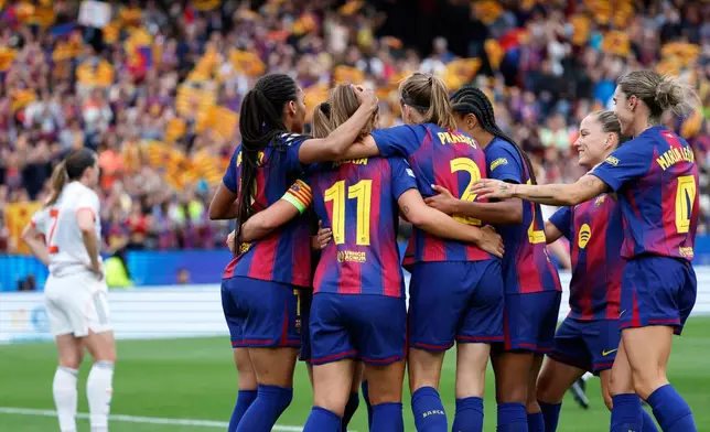 Barcelona players celebrate after Alexia Putellas scored their fourth goal during the women's Champions League semifinal soccer match between FC Barcelona and FC Bayern Munich in Barcelona, Spain, Sunday, May 3, 2026. (AP Photo/Joan Monfort)