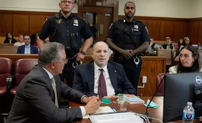 Harvey Weinstein, center, defense attorneys Marc Agnifilo, left, and Teny Geragos, right, appear in criminal court, in New York, Tuesday, April 28, 2026. (AP Photo/Richard Drew, Pool)