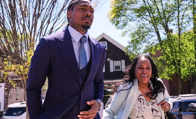 Former New England Patriots wide receiver Stefon Diggs returns to Norfolk County District Court, Monday, May 4, 2026, in Dedham, Mass. (AP Photo/Charles Krupa)