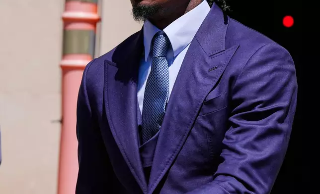 Former New England Patriots wide receiver Stefon Diggs leaves Norfolk County District Court, Monday, May 4, 2026, in Dedham, Mass. (AP Photo/Charles Krupa)