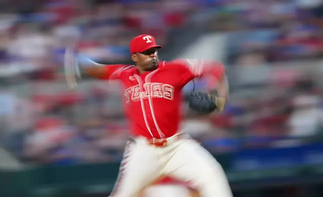 Texas Rangers starting pitcher Kumar Rocker throws to the Chicago Cubs during the fourth inning of a baseball game Friday, May 8, 2026, in Arlington, Texas. (AP Photo/Julio Cortez)