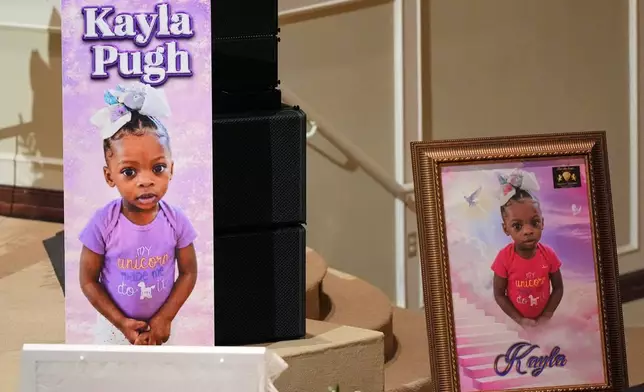 Photos of Kayla Pugh are displayed during funeral services for the eight children who were killed during a mass shooting last month, Saturday, May 9, 2026, at the Summer Grove Baptist Church in Shreveport, La. (AP Photo/Gerald Herbert)