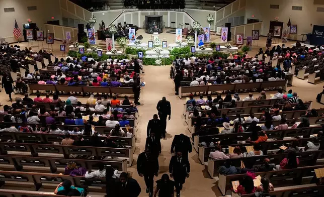 Caskets for the eight children killed during a mass shooting last month are seen during funeral services for the children Saturday, May 9, 2026, at the Summer Grove Baptist Church in Shreveport, La. (AP Photo/Gerald Herbert)