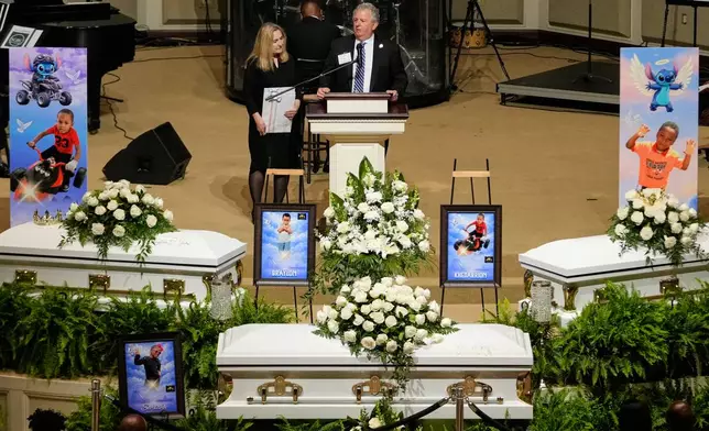 Shreveport Mayor Tom Arceneaux speaks during funeral services for the eight children who were killed during a mass shooting last month, Saturday, May 9, 2026, at the Summer Grove Baptist Church in Shreveport, La. (AP Photo/Gerald Herbert)