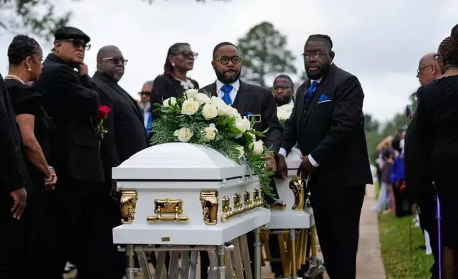 The caskets of the eight children who were killed during a mass shooting last month, arrive for burial Saturday, May 9, 2026, at Forest Park Cemetery West in Shreveport, La. (AP Photo/Gerald Herbert)