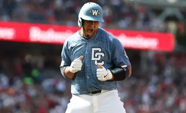 Washington Nationals' Keibert Ruiz celebrates as he runs the bases after hitting a three-run home run off Baltimore Orioles pitcher Chris Bassitt which scored CJ Abrams and Nasim Nunez during the second inning of a baseball game, Saturday, May 16, 2026, in Washington. (AP Photo/Terrance Williams)