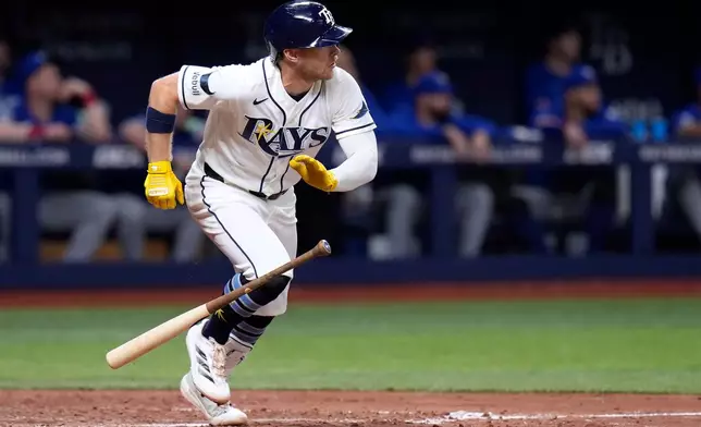 Tampa Bay Rays' Taylor Walls watches his two-run single off Toronto Blue Jays pitcher Mason Fluharty during the sixth inning of a baseball game Monday, May 4, 2026, in St. Petersburg, Fla. (AP Photo/Chris O'Meara)