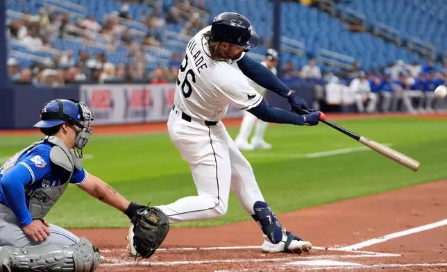Tampa Bay Rays' Ryan Vilade (26) connects for a three-run home run off Toronto Blue Jays pitcher Eric Lauer during the first inning of a baseball game Monday, May 4, 2026, in St. Petersburg, Fla. (AP Photo/Chris O'Meara)