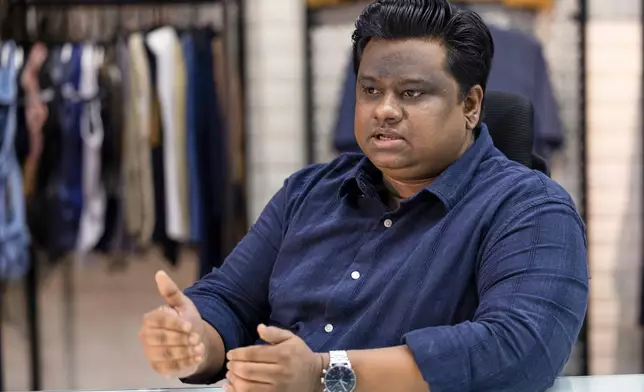 Alvi Islam, director of Arrival Fashion Limited, talks to The Associated Press, in Dhaka, Bangladesh, Tuesday, April 28, 2026. (AP Photo/Abdul Goni)