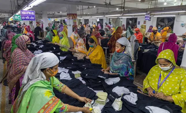 Women workers assemble apparel at a garment factory in Dhaka, Bangladesh, Tuesday, April 28, 2026. (AP Photo/Abdul Goni)